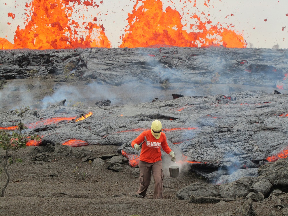 A geologist is seen collecting samples of molten lava from the 2011 Kamoamoa eruption, at Kilauea Volcano, Hawaii in this picture taken March 6, 2011 courtesy of USGS. u00e2u20acu201d Reuters pic  