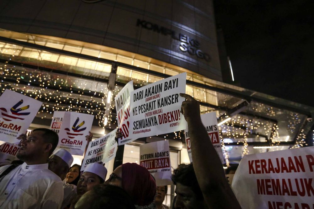 Protesters are seen in front of the Sogo shopping complex in Kuala Lumpur July 6, 2018.