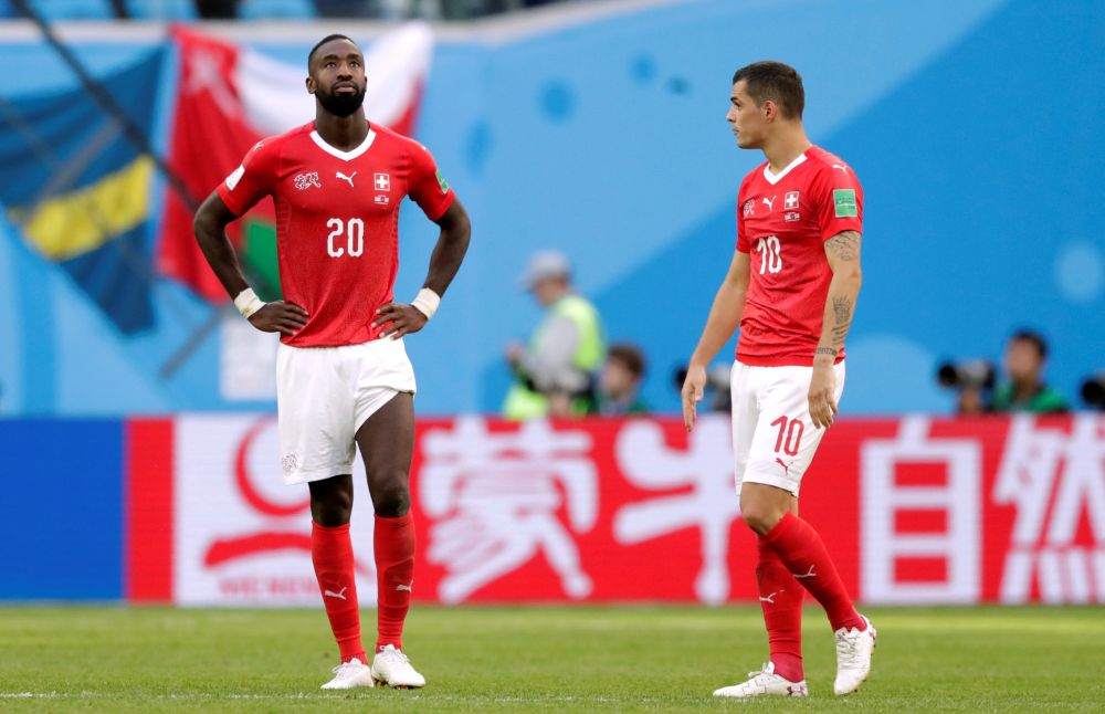 Switzerland's Johan Djourou and Granit Xhaka look dejected after the match against Sweden, July 3, 2018. u00e2u20acu2022 Reuters pic