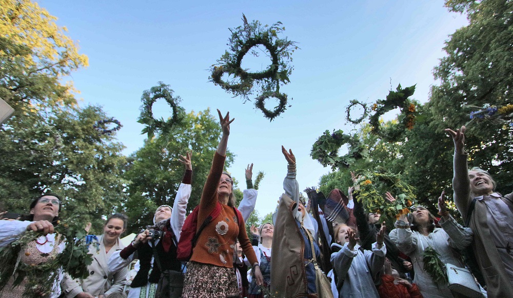 People participate in a traditional Lithuanian summer solstice in Verkiai Park in Vilnius June 22, 2018. u00e2u20acu201d AFP pic