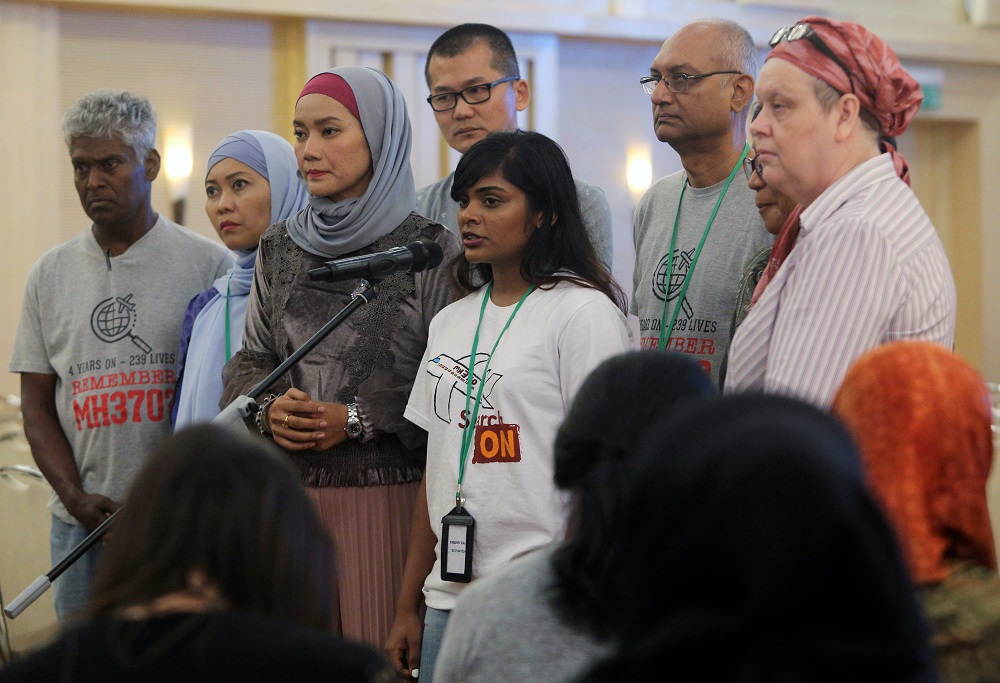 Family members speak to the media after an MH370 closed door meeting in Putrajaya July 30, 2018. u00e2u20acu201d Reuters pic