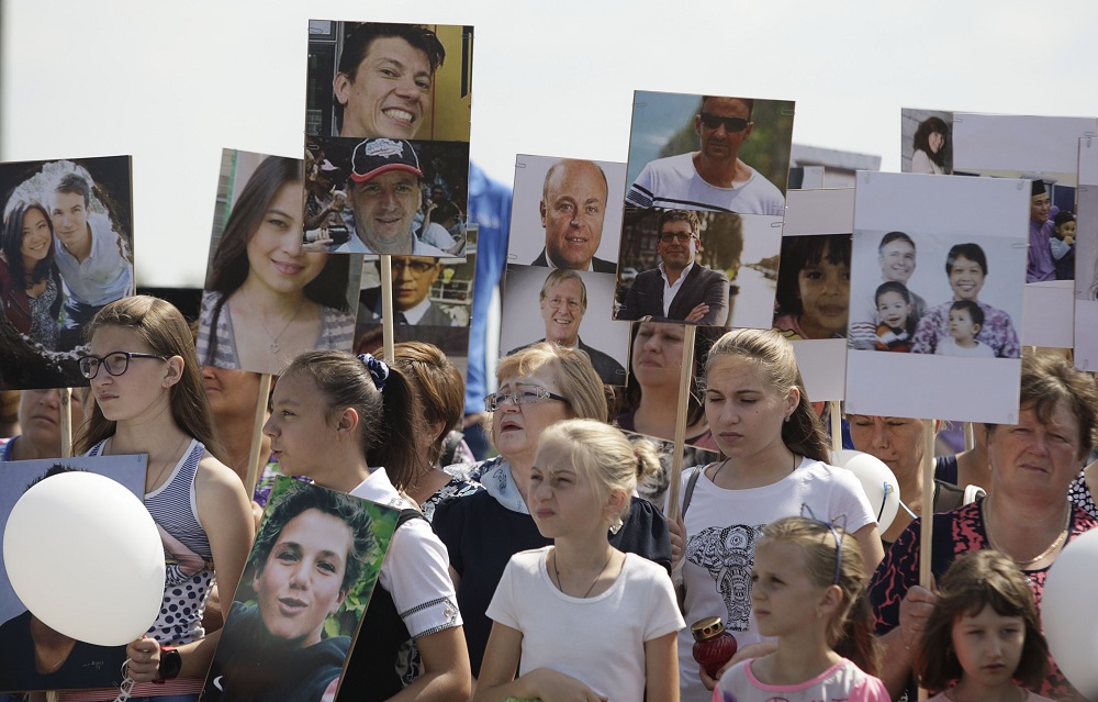 People gather near a monument for the victims of the Malaysia Airlines flight MH17 plane crash to mark the fourth anniversary of the accident near the village of Hrabove (Grabovo) in Donetsk Region, Ukraine July 17, 2018. u00e2u20acu201d Reuters pic