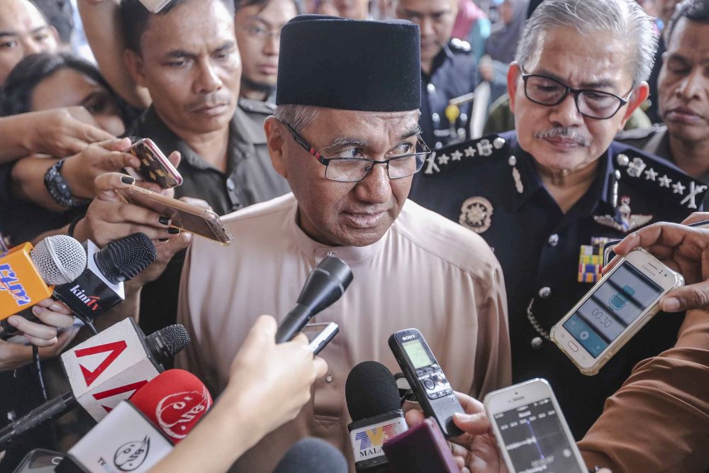 Inspector-General of Police Tan Sri Mohamad Fuzi Harun speaks to reporters at the Home Ministryu00e2u20acu2122s Aidilfitri open house  in Putrajaya July 5, 2018. u00e2u20acu201d Picture by Firdaus Latif