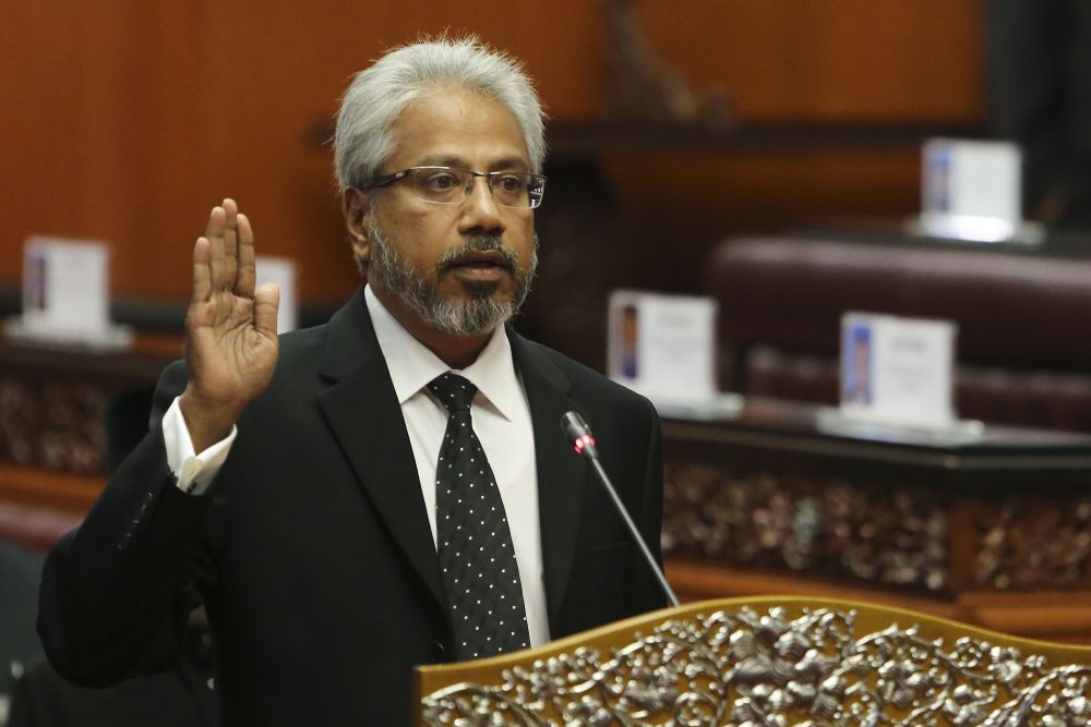 P. Waytha Moorthy is sworn in as a Senator in front of Dewan Negara president Datuk SA Vigneswaran at Parliament in Kuala Lumpur July 17, 2018. u00e2u20acu2022 Picture by Yusof Mat Isan