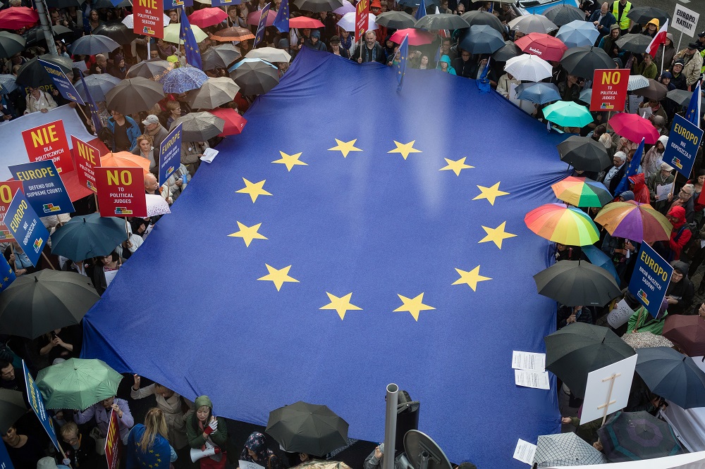 In this file photo taken on June 26, 2018 people deploy a giant European flag during a demonstration against Government plans of Judicial system reforms in front of the European Commission Representation office in Warsaw. u00e2u20acu201d AFP pic