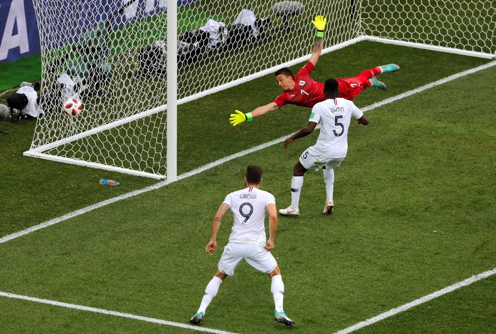 Uruguayu00e2u20acu2122s Fernando Muslera concedes as Franceu00e2u20acu2122s Raphael Varane scores their first goal during their World Cup Quarter Final match in Nizhny Novgorod Stadium, Nizhny Novgorod, Russia July 6, 2018. u00e2u20acu201d Reuters pic