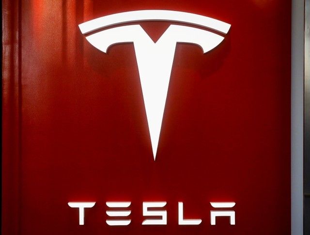 The Tesla logo is seen at the entrance to Tesla Motorsu00e2u20acu2122 new showroom in Manhattanu00e2u20acu2122s Meatpacking District in New York City, December 14, 2017. u00e2u20acu201d Reuters pic