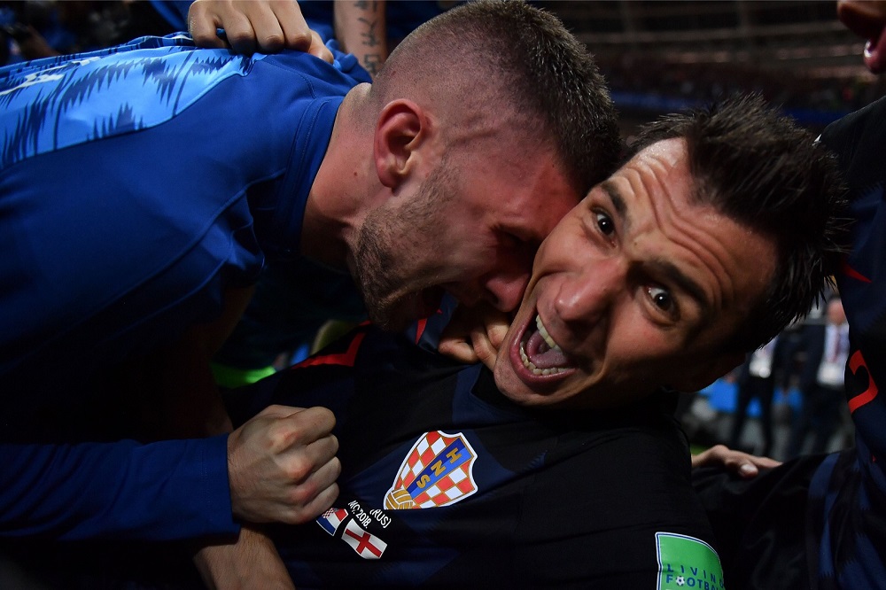 Croatia’s forward Mario Mandzukic (right) celebrates with teammates after scoring his team’s second goal during the Russia 2018 World Cup semi-final match at the Luzhniki Stadium in Moscow July 11, 2018. — Reuters pic