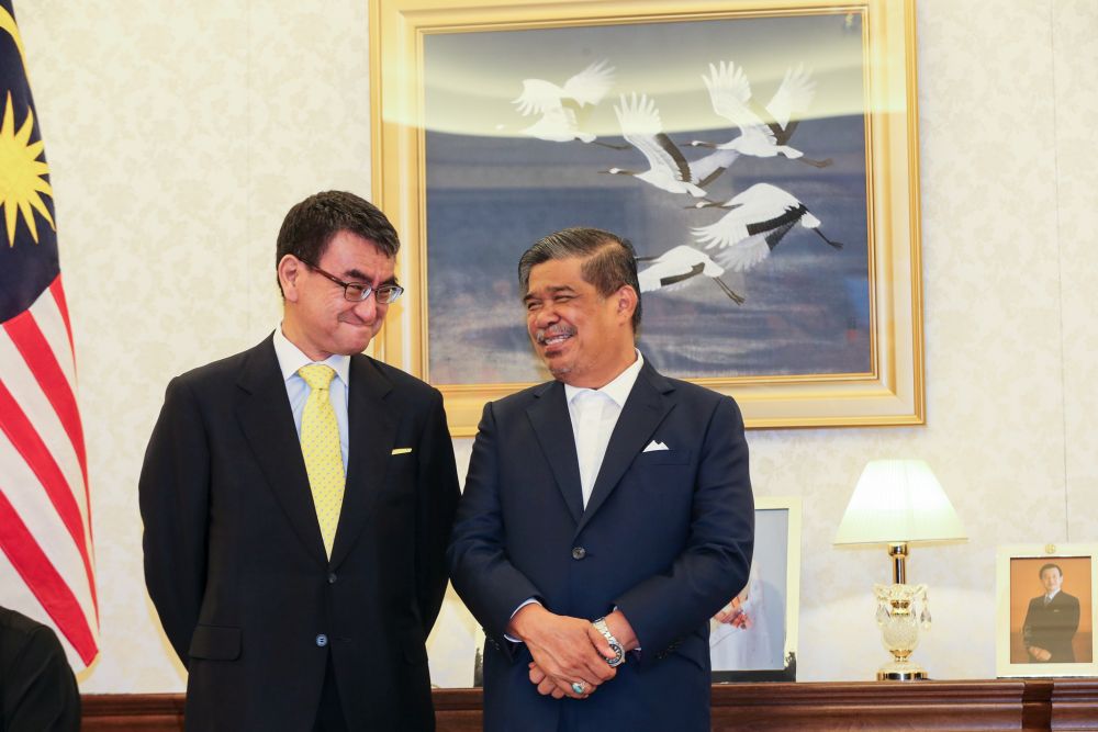 Minister for Foreign Affairs of Japan Taro Kono is seen talking to Defence Minister Mohamad Sabu at the Embassy Residency of Japan during his official visit to Malaysia July 11,2018. u00e2u20acu201d Picture by Ahmad Zamzahuri