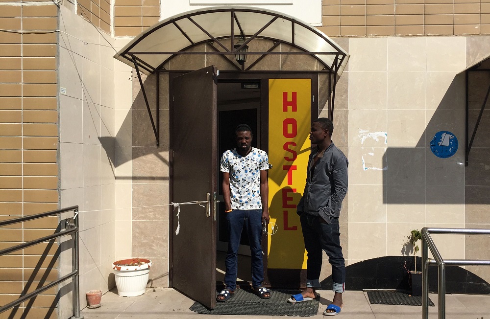 A 25-year-old Nigerian Sodiq Olamilekan (left) stands next to his 21-year-old brother Ismail at a door of a hostel in Moscow July 12, 2018. u00e2u20acu201d AFP pic