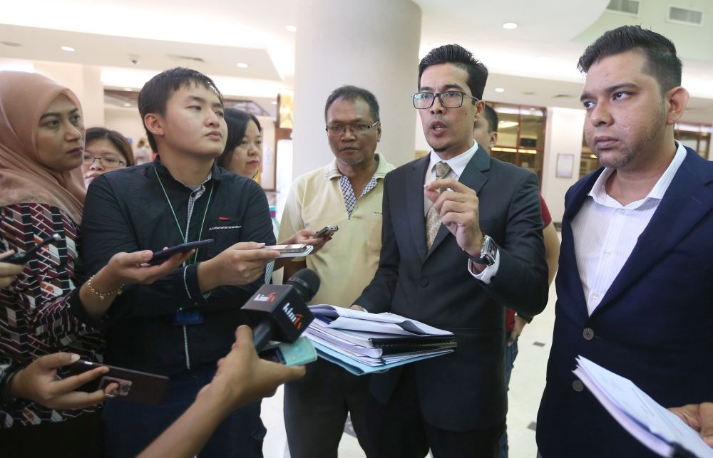 Adnan Seman (second from right) speaks to reporters regarding KL Karnival Sdn Bhdu00e2u20acu2122s suit against Perbadanan Stadium Malaysia  July 5, 2018. u00e2u20acu201d Picture by Razak Ghazali