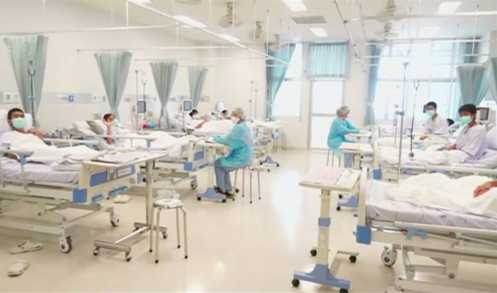 Boys rescued from the Thai cave wear masks and rest at a hospital in Chiang Rai, Thailand in this still image taken from a July 11, 2018 handout video. u00e2u20acu201d Reuters pic