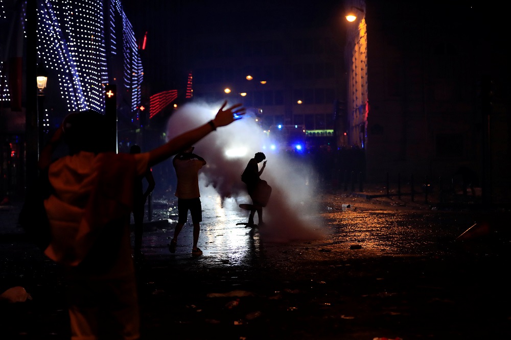 France fans face off with CRS riot police during clashes on the Champs-Elysees avenue after France win the World Cup final, July 15, 2018. u00e2u20acu201d Reuters pic