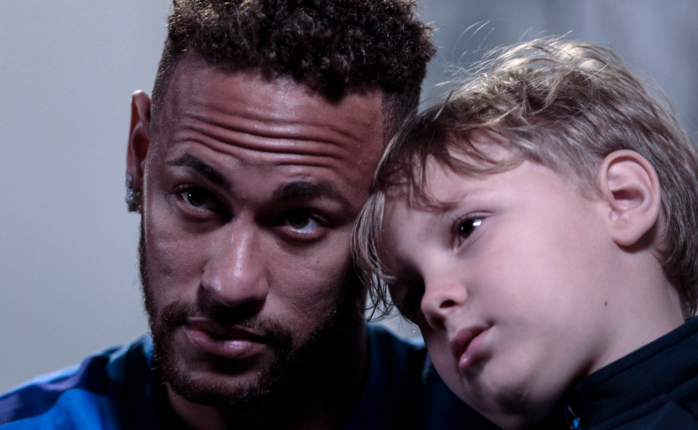 Neymar, with his son Davi Lucca, in an interview at his charity Neymar Junior Project Institute, in Praia Grande, Sao Paulo, Brazil July 21, 2018. u00e2u20acu201d AFP picn