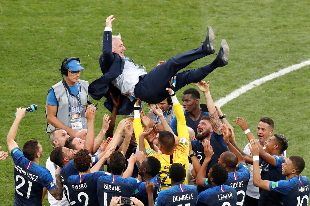 France coach Didier Deschamps is held up by players to celebrate winning the World Cup at the Luzhniki Stadium, Moscow July 15, 2018. u00e2u20acu201d Reuters pic