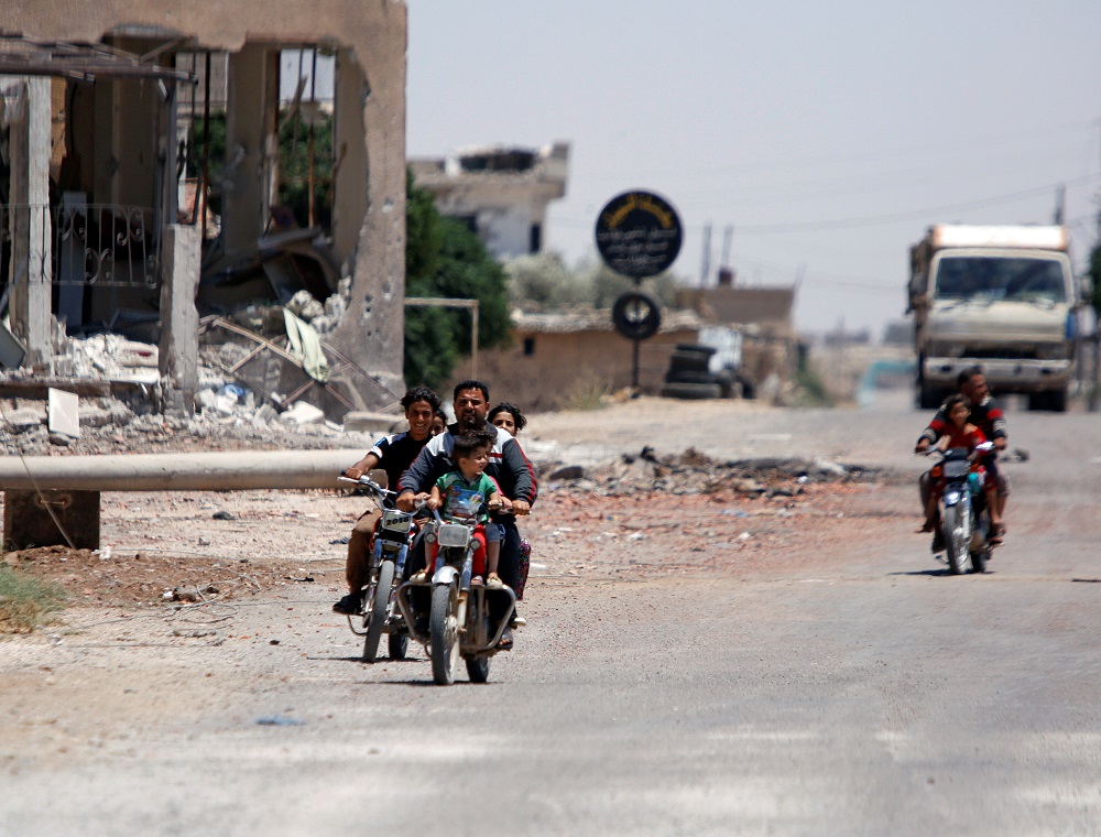 People ride motorbikes in Umm al-Mayazen, in the countryside of Deraa, Syria, July 10, 2018. u00e2u20acu201d Reuters pic
