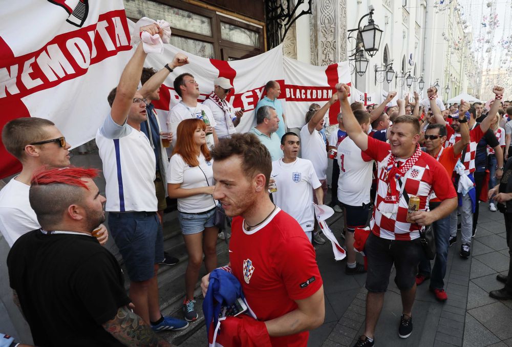 Croatia fans walk through a crowd of supporters of team England during a gathering in the Moscow city centre, July 11, 2018 u00e2u20acu2022 Reuters pic