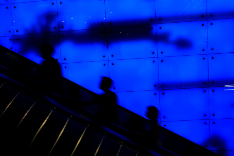 People ride up an escalator at a shopping mall in Singapore June 17, 2017.  u00e2u20acu201d Reuters pic 