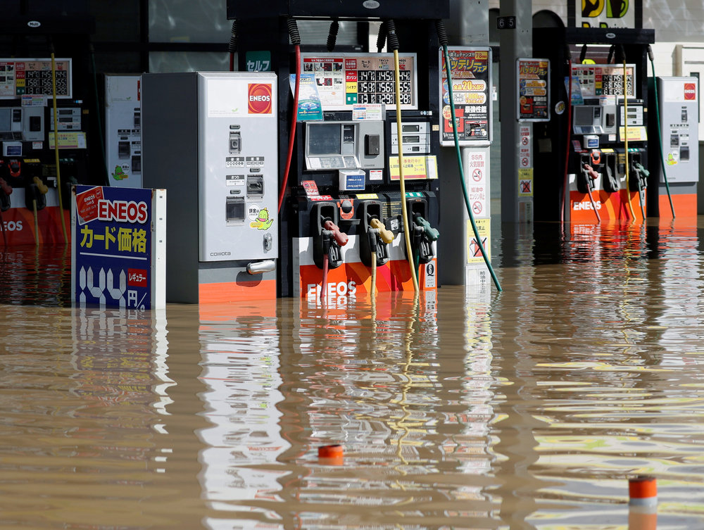 A gasoline stand is flooded by heavy rain at Mabi town in Kurashiki, Okayama Prefecture, Japan July 8, 2018. u00e2u20acu201d Reuters pic