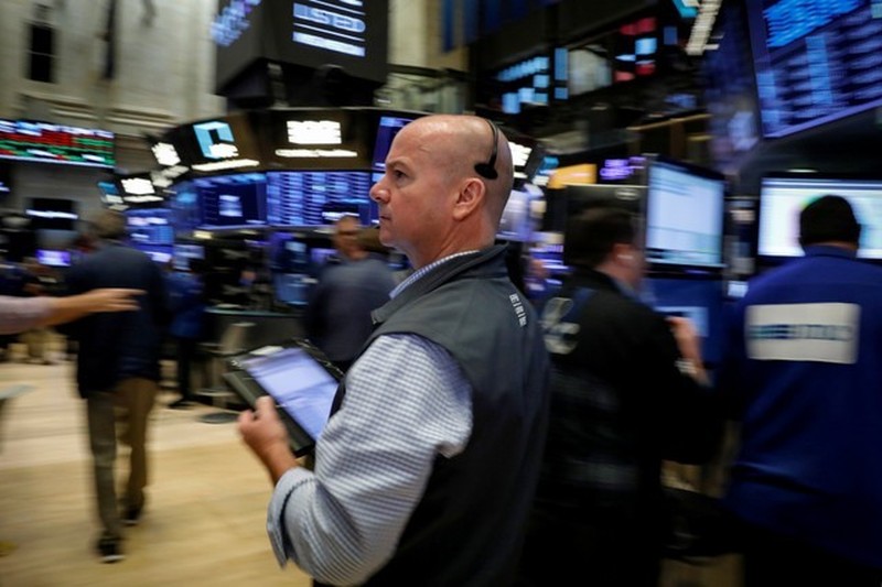 Traders work on the floor of the New York Stock Exchange (NYSE) July 6, 2018. u00e2u20acu201d Reuters picn