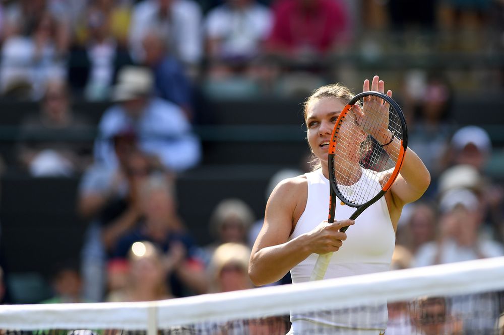 Romaniau00e2u20acu2122s Simona Halep celebrates winning against Chinau00e2u20acu2122s Zheng Saisai during their womenu00e2u20acu2122s singles second round match on Day 4 of the 2018 Wimbledon Championships at The All England Lawn Tennis Club in Wimbledon, July 5, 2018. u00e2u20acu201d AFP pic