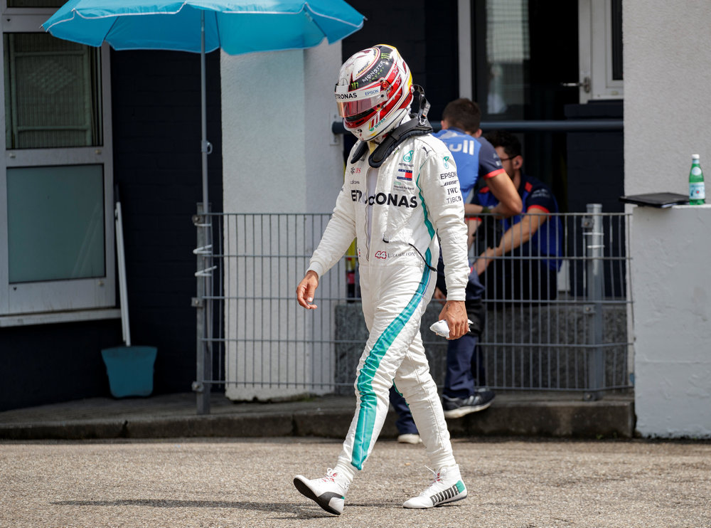 Mercedes' Lewis Hamilton walks through the pit lane after his car broke down on track during qualifying for the F1 German Grand Prix in Hockenheim July 21, 2018. u00e2u20acu201d Reuters pic