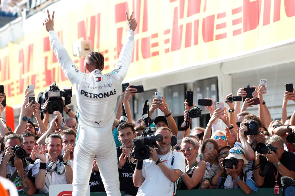 Mercedes' Lewis Hamilton celebrates winning the race. u00e2u20acu201d Reuters pic