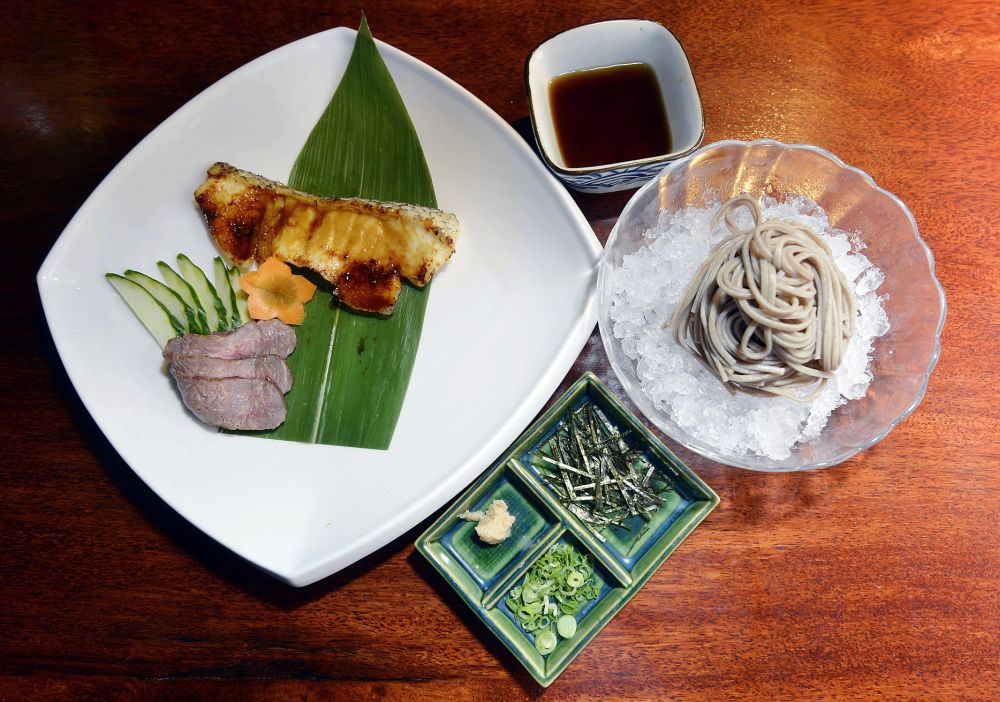Wagyu tataki and cod teriyaki served with cold soba noodles at Hanare.