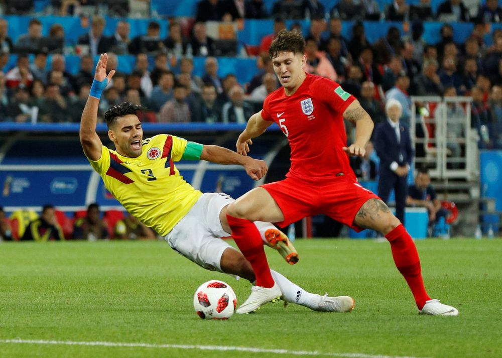 Colombiau00e2u20acu2122s Radamel Falcao in action with Englandu00e2u20acu2122s John Stones during their World Cup Round of 16 match in Spartak Stadium, Moscow, July 3, 2018. u00e2u20acu201d Reuters pic