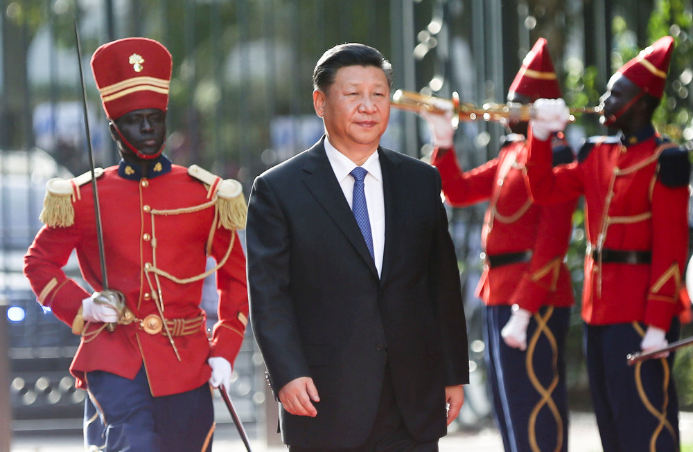 Chinese President Xi Jinping walks along the red carpet in front of a guard-of-honour at the Presidential Palace during his visit to Dakar, Senegal July 21, 2018. u00e2u20acu201d Reuters pic
