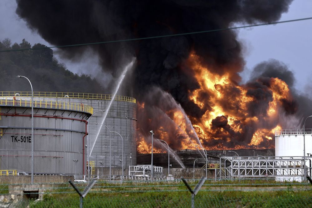 The Fire and Rescue Department works to extinguish a fire involving three crude oil tanks owned by Kemaman Bitumen Company (KBC) in Teluk Kalong industrial area in Kemaman, July 6, 2018. u00e2u20acu201d Bernama pic
