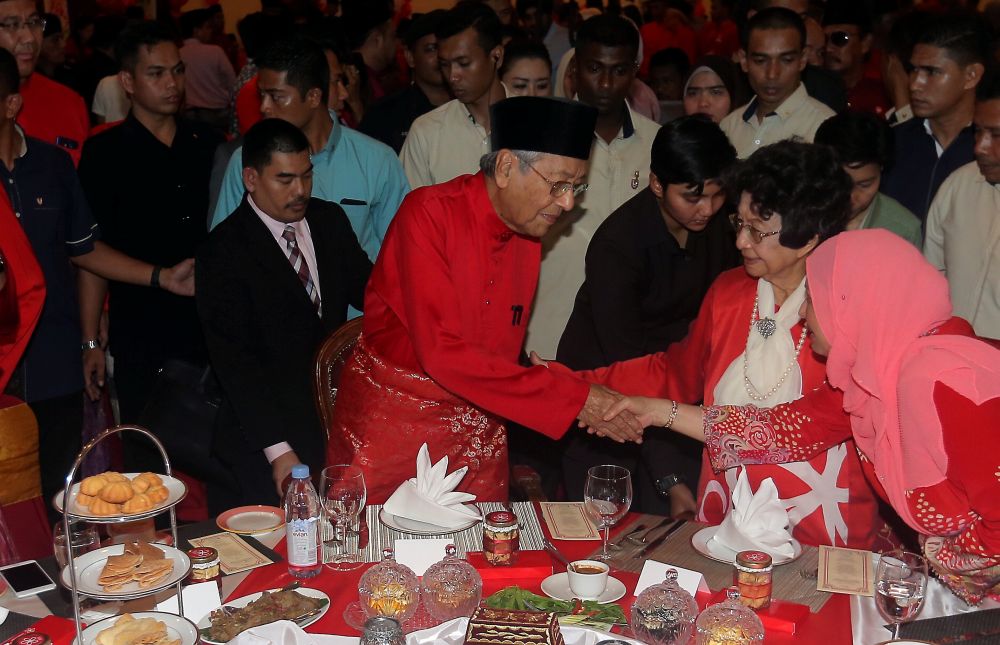 Tun Dr Mahathir Mohamad and Tun Dr Siti Hasmah greet guests at PPBM's Hari Raya open house at Bukit Merah Laketown Resort today, July 6, 2018. u00e2u20acu2022 Picture by Farhan Najib