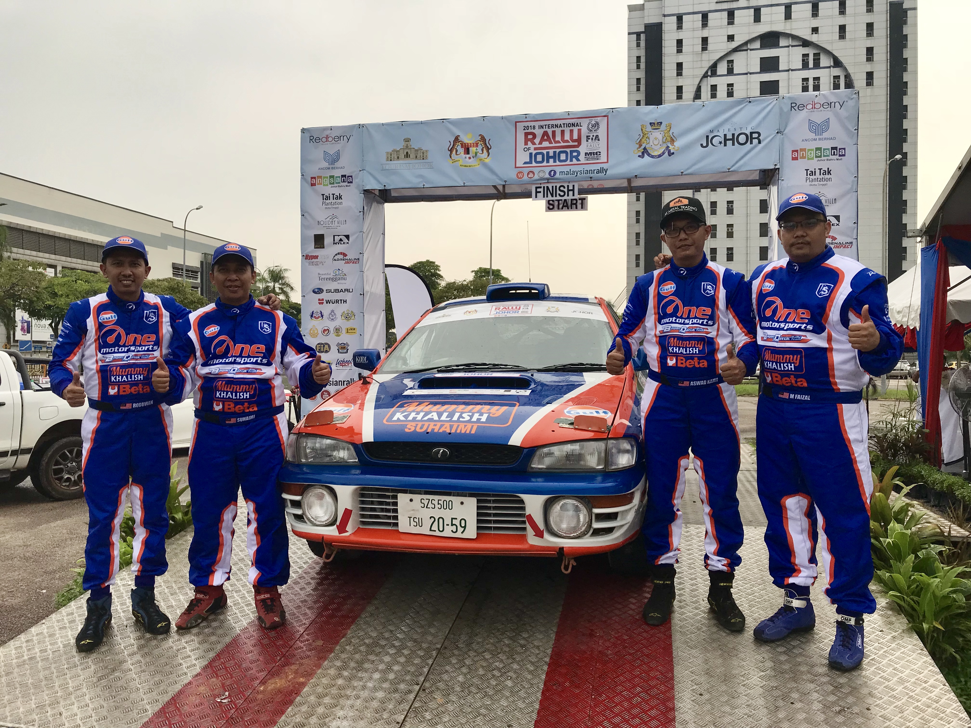 One Motorsport Bagan Datuk Rally Team’s (BDRT) Suhaimi Nasro Ali  (second from left) with his team members during the 2018 International Rally of Johor closing ceremony held at Angsana Mall in Johor Baru today. — Picture by Ben Tan