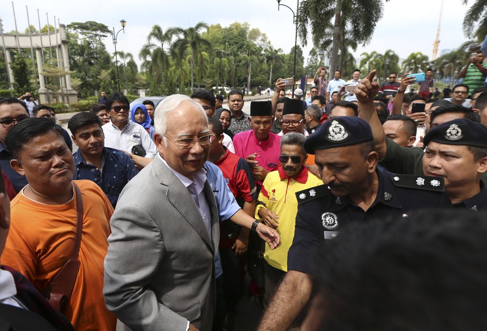 Datuk Seri Najib Razak made an appearance at the KL courthouse this morning to settle the remaining RM500,000 of his bail, July 9, 2018. ― Picture by Azneal Ishak