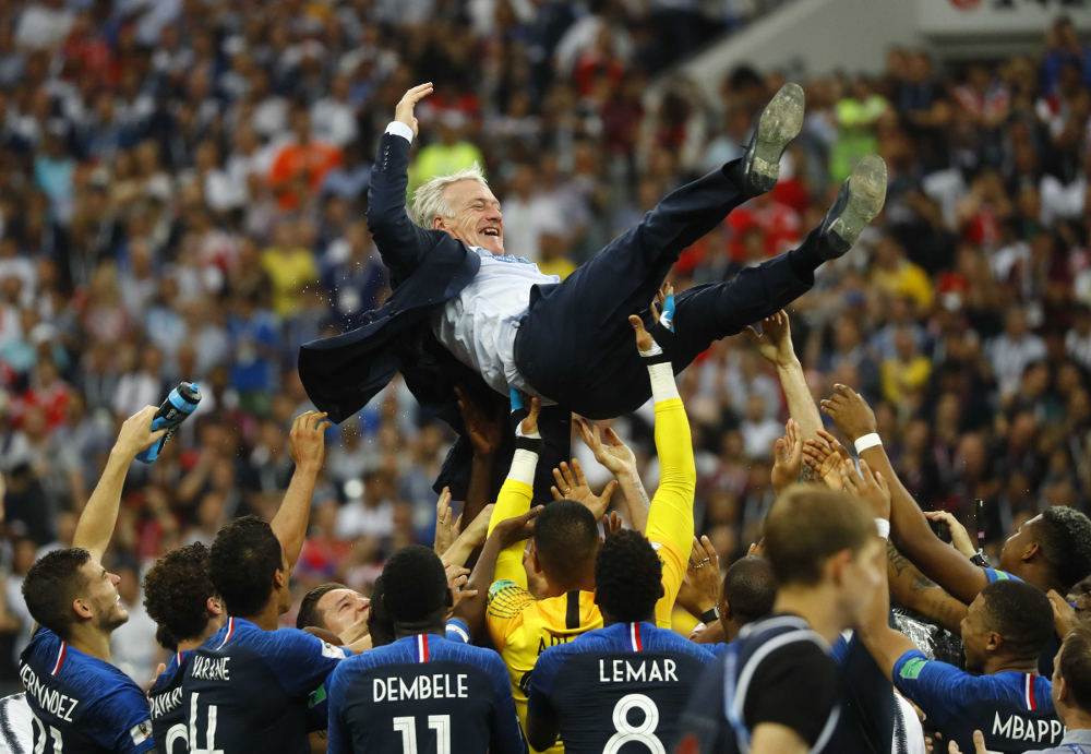 France players celebrate winning the World Cup with coach Didier Deschamps after the final match against Croatia at Luzhniki Stadium, Moscow July 15, 2018. u00e2u20acu201d Reuters pic