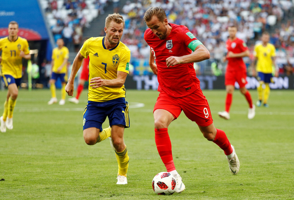 Englandu00e2u20acu2122s Harry Kane in action with Swedenu00e2u20acu2122s Sebastian Larsson during their World Cup Quarter Final match at the Samara Arena, Samara July 7, 2018. u00e2u20acu201d Reuters pic