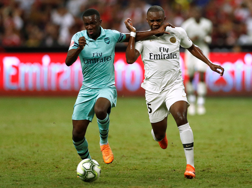 Arsenalu00e2u20acu2122s Edward Nketiah in action with Paris St Germainu00e2u20acu2122s Jean-Christophe Bahebeck during their International Champions Cup match at the u00e2u20acu201d Singapore National Stadium, Singapore July 28, 2018. u00e2u20acu201d Reuters pic