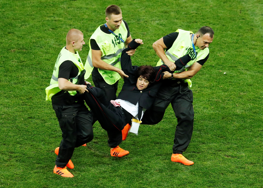 Stewards apprehend a pitch invader during the World Cup final match between France and Croatia at Luzhniki Stadium, Moscow July 15, 2018. u00e2u20acu201d Reuters pic