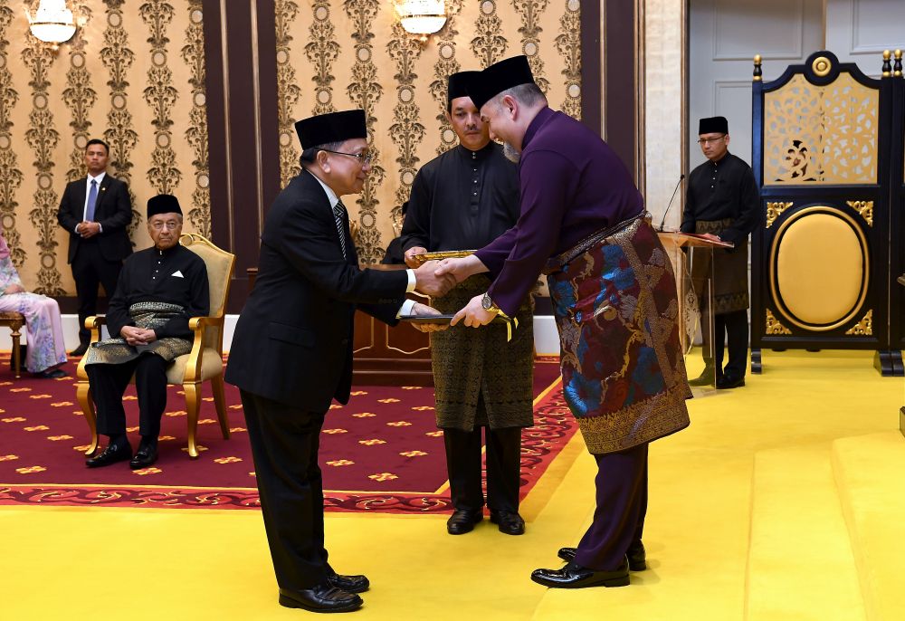 Tan Sri Richard Malanjum receives his letter of appointment as the new Chief Justice from the Yang di-Pertuan Agong Sultan Muhammad V at Istana Negara, Kuala Lumpur July 11, 2018. u00e2u20acu201d Bernama pic 