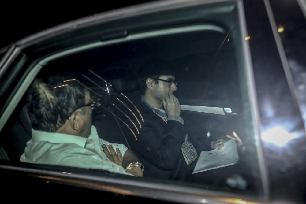 A vehicle carrying Riza Aziz (right) is seen leaving the compound of the Malaysian Anti-Corruption Commission headquarters in Putrajaya July 4, 2018. u00e2u20acu201d Picture by Hari Anggara