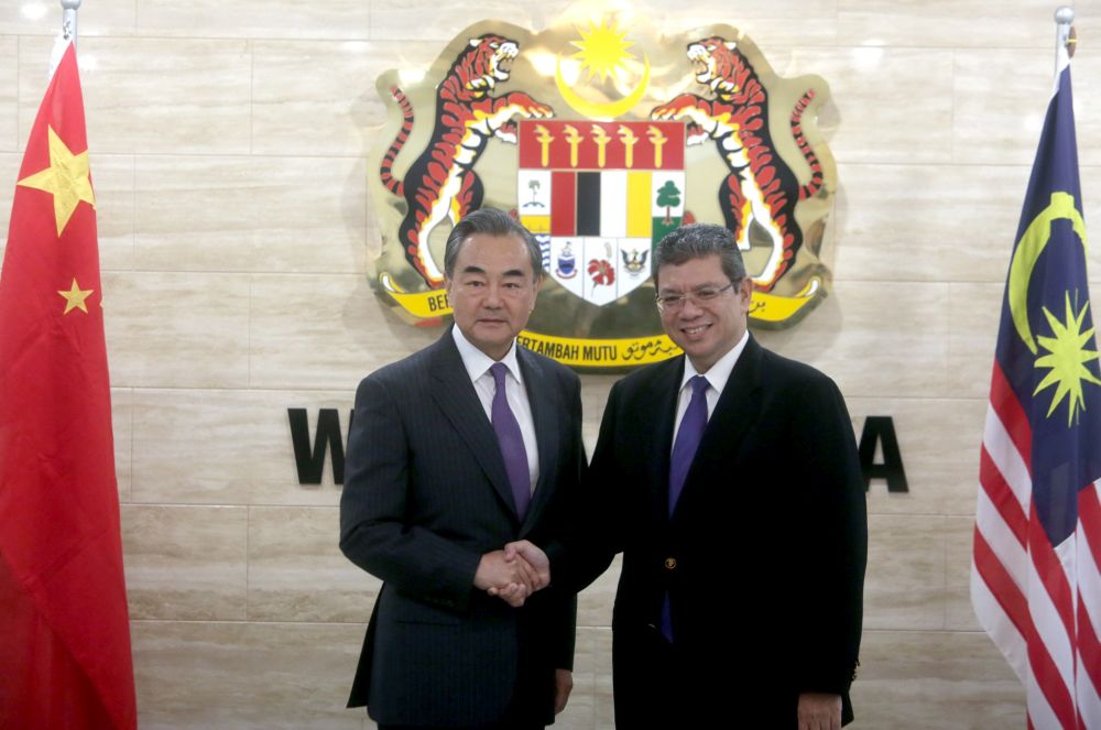 Foreign Minister Datuk Saifuddin Adullah receives a courtesy call from China Foreign Minister Wang Yi in Putrajaya July 31, 2018. u00e2u20acu2022 Picture by Razak Ghazali