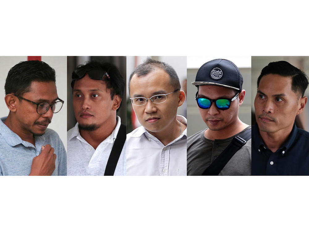 (From left) Mohamed Farid Mohd Saleh, Muhammad Nur Fatwa Mahmood, Chong Chee Boon Kenneth, Adighazali Suhaimi and Nazhan Mohamed Nazi were the five SCDF personnel charged in the District Court on July 25. u00e2u20acu201d TODAY pic