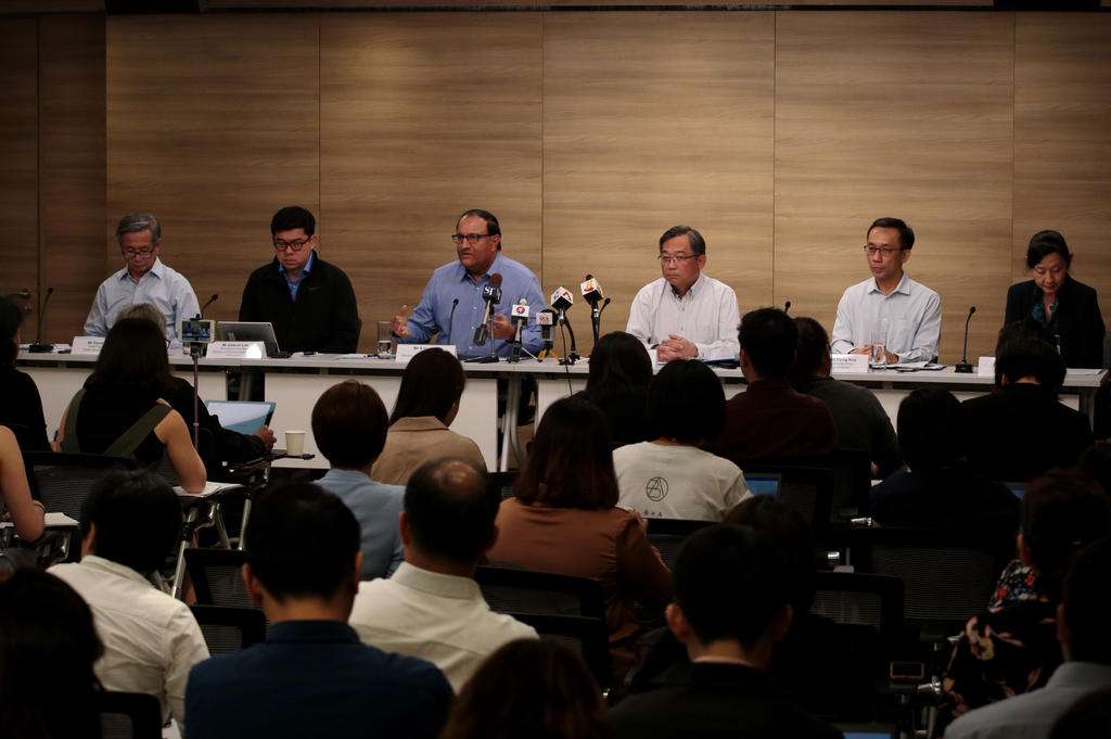 Minister for Communications and Information S Iswaran (centre) speaks alongside Minister for Health Gan Kim Yong (third from right) during a press briefing on a 'major cyber attack' on SingHealth, July 20, 2018. u00e2u20acu201d Jason Quah/TODAY pic 