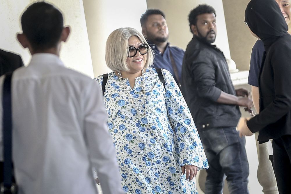 Siti Kasim (centre) arrives at the Magistrateu00e2u20acu2122s Court in Kuala Lumpur July 27, 2018. u00e2u20acu2022 Picture by Hari Anggara