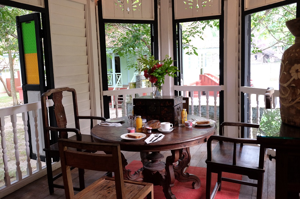 The dining area at the ‘Black and White’ house overlooks the serene grounds around the resort. 