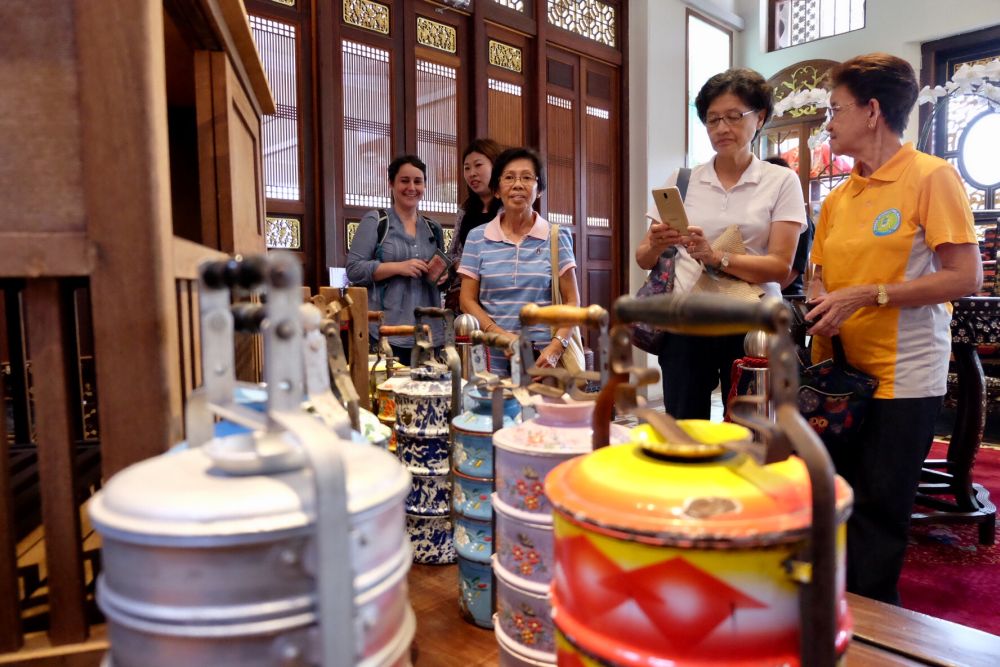 The enameled and metal tiffin carriers showcased in Seven Terraces.