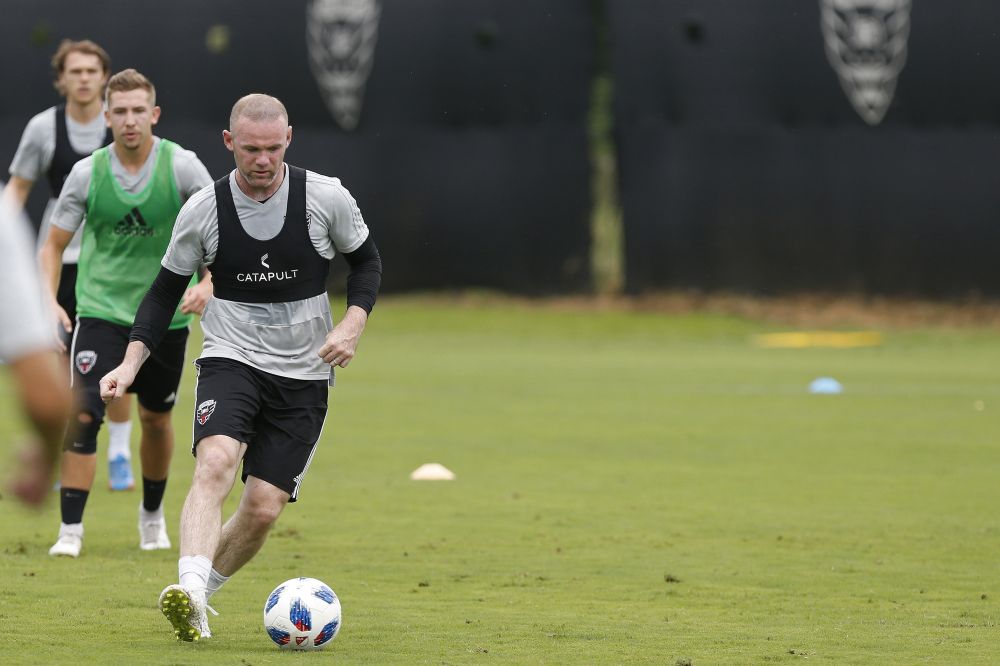 DC United forward Wayne Rooney dribbles the ball during drills as part of training at RFK Auxiliary Field in Washington July 7, 2018. u00e2u20acu2022 Geoff Burke-USA TODAY Sports/Reuters pic