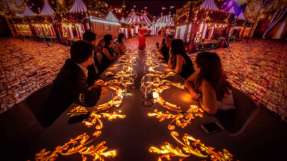 Roll up for the main course, Circus, with walls adorned in red-and-white big top tents.