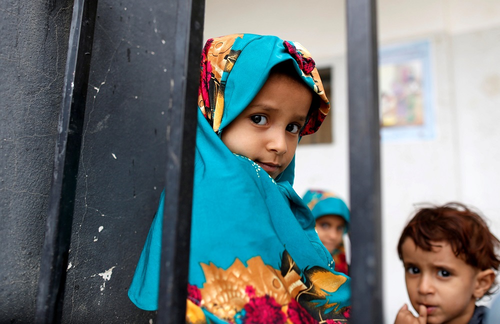 Children displaced from the Red Sea port city of Hodeidah are seen behind a fence in a school where IDPs temporarily live in Sanaa, Yemen July 1, 2018. u00e2u20acu201d Reuters pic
