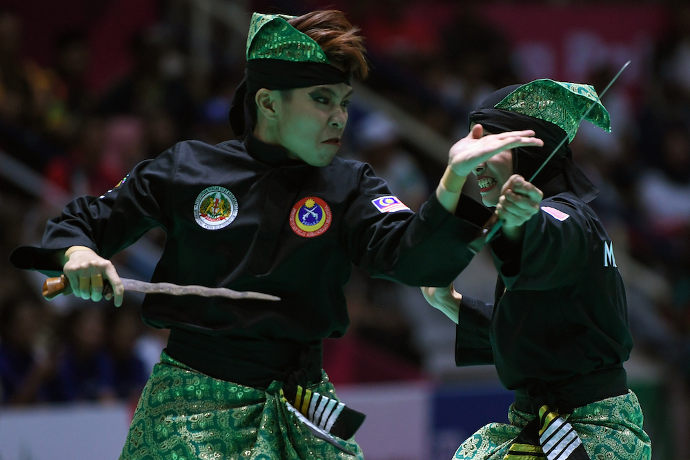 Malaysiau00e2u20acu2122s Nur Syazreen A. Malik and Nor Hamizah Abu Hassan compete during the pencak silat womenu00e2u20acu2122s double finals match at the 2018 Asian Games at Jakarta August 29, 2018. u00e2u20acu201d AFP pic
